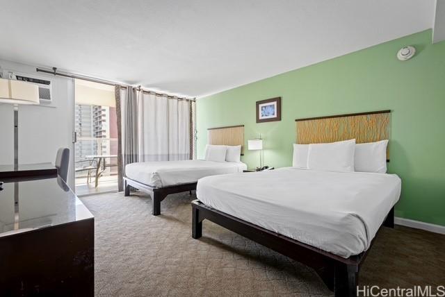 445 Seaside Ave Unit 2608, Honolulu, HI 96815 - bedroom featuring a wall mounted AC, access to outside, and carpet flooring