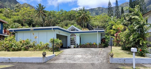 46-046 Puulau Pl, Kaneohe, HI 96744 - view of front of house featuring board and batten siding and a mountain view