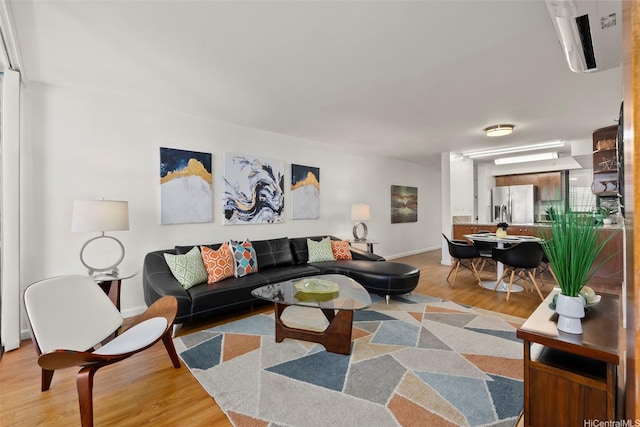 990 Ala Nanala St Unit 35B, Honolulu, HI 96818 - living room with light wood-type flooring and baseboards