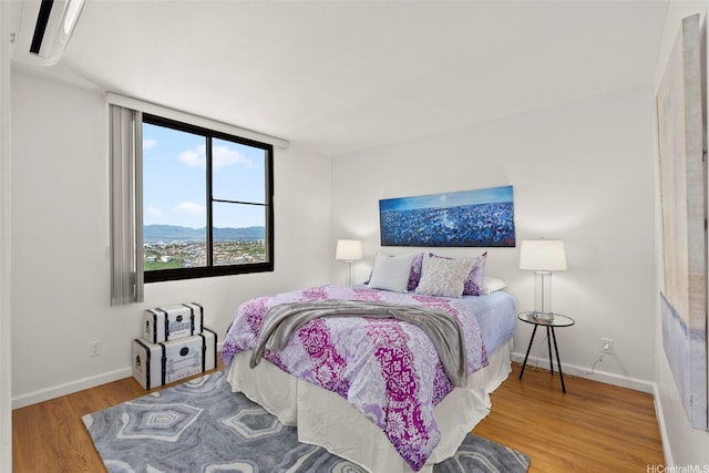 990 Ala Nanala St Unit 35B, Honolulu, HI 96818 - bedroom featuring wood finished floors and baseboards