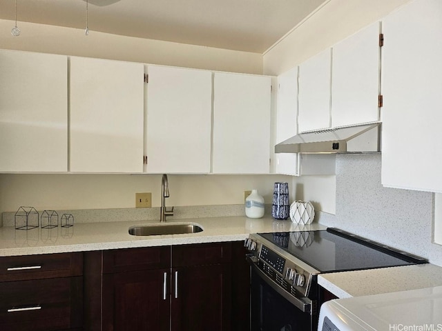 670 Prospect St Unit 606, Honolulu, HI 96813 - kitchen with electric range oven, under cabinet range hood, light countertops, dark brown cabinetry, and white cabinetry