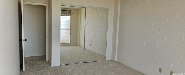 670 Prospect St Unit 606, Honolulu, HI 96813 - unfurnished bedroom featuring light colored carpet, a closet, and a wall unit AC