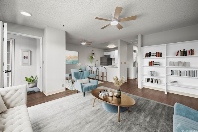 46-263 Kahuhipa St Unit B303, Kaneohe, HI 96744 - living room featuring wood finished floors, ceiling fan, a textured ceiling, and electric panel