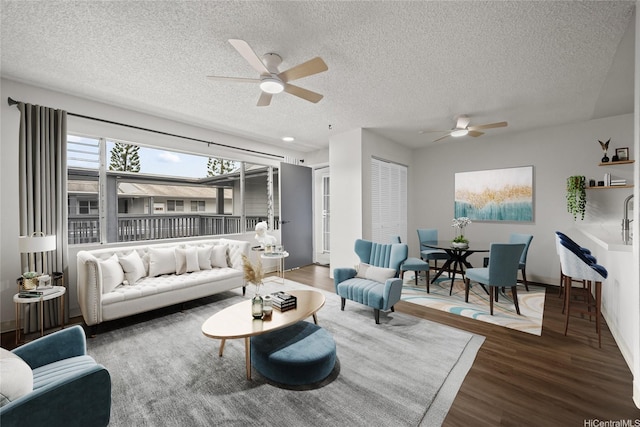 46-263 Kahuhipa St Unit B303, Kaneohe, HI 96744 - living area featuring ceiling fan, a textured ceiling, and wood finished floors