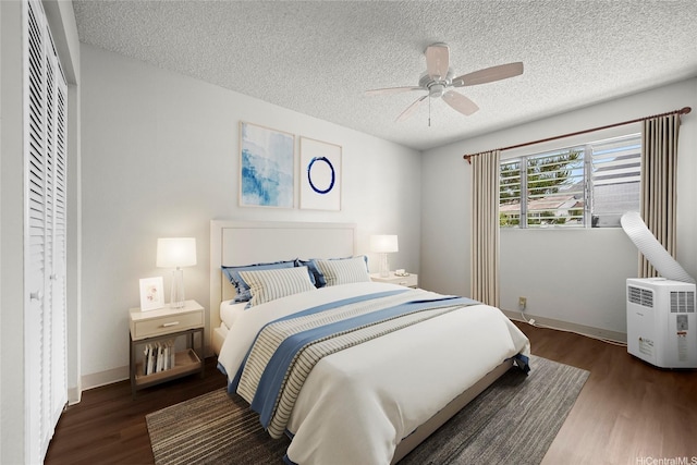46-263 Kahuhipa St Unit B303, Kaneohe, HI 96744 - bedroom with wood finished floors, a textured ceiling, and a ceiling fan