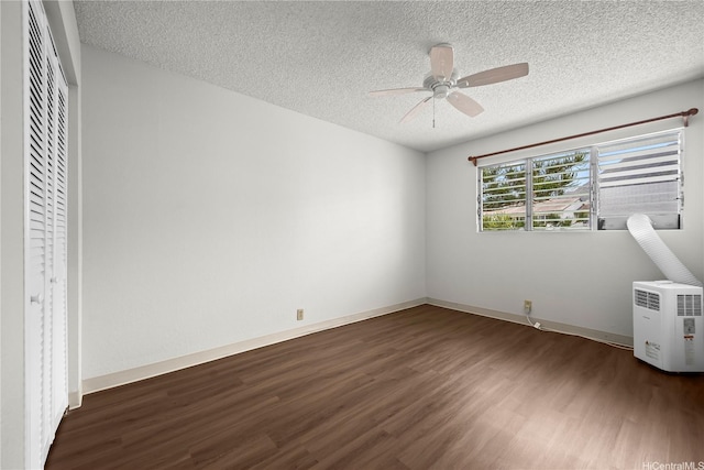 46-263 Kahuhipa St Unit B303, Kaneohe, HI 96744 - unfurnished bedroom featuring wood finished floors, a textured ceiling, a ceiling fan, and a closet