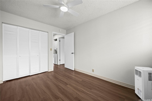 46-263 Kahuhipa St Unit B303, Kaneohe, HI 96744 - unfurnished bedroom with dark wood-style flooring, a textured ceiling, a closet, and a ceiling fan