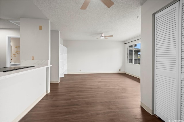 46-263 Kahuhipa St Unit B303, Kaneohe, HI 96744 - unfurnished living room featuring ceiling fan, dark wood-style floors, and a textured ceiling