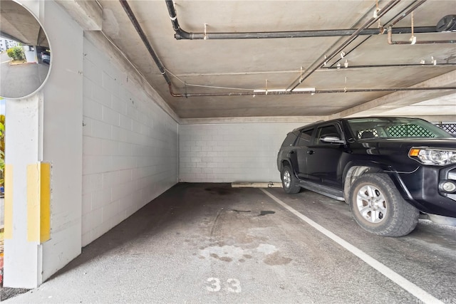 46-263 Kahuhipa St Unit B303, Kaneohe, HI 96744 - parking garage featuring concrete block wall