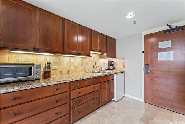 2045 Kalakaua Ave Unit 403, Honolulu, HI 96815 - kitchen with dishwasher, backsplash, light stone counters, and light tile patterned flooring