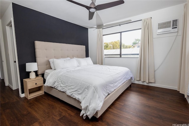 94-1010 Awalua St, Waipahu, HI 96797 - bedroom with a wall unit AC, dark wood-style flooring, and a ceiling fan