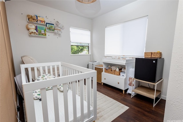 94-1010 Awalua St, Waipahu, HI 96797 - bedroom with wood finished floors and a crib
