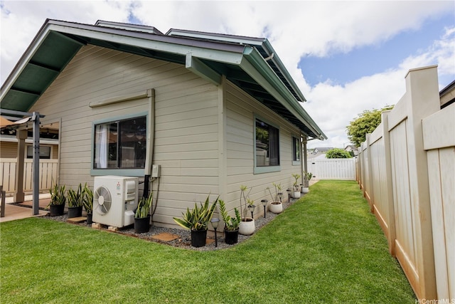 94-1010 Awalua St, Waipahu, HI 96797 - view of home's exterior featuring a cooling unit and a fenced backyard