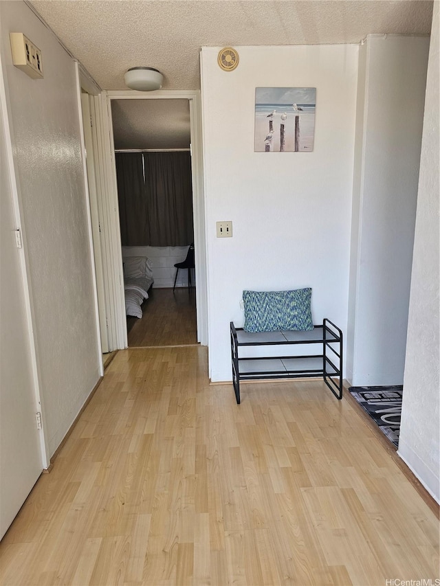 1702 Kewalo St Unit 204, Honolulu, HI 96822 - corridor featuring wood finished floors and a textured ceiling