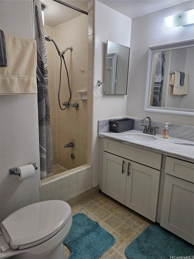 1702 Kewalo St Unit 204, Honolulu, HI 96822 - bathroom with tiled shower / bath, vanity, and a textured wall