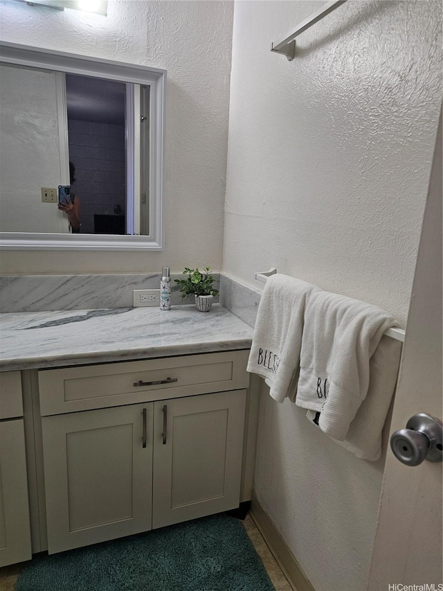 1702 Kewalo St Unit 204, Honolulu, HI 96822 - bathroom featuring vanity and a textured wall