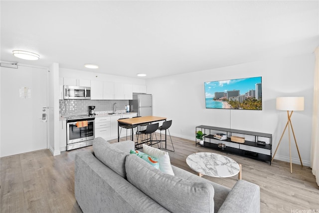 201 Oahu Ave Unit 1111, Honolulu, HI 96815 - living area with light wood-style flooring and baseboards