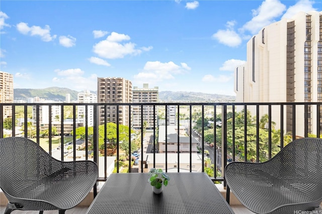 201 Oahu Ave Unit 1111, Honolulu, HI 96815 - balcony with a mountain view and outdoor dining space