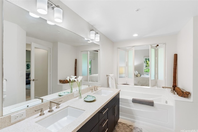 437 Kailua Rd Unit 6107, Kailua, HI 96734 - full bathroom featuring double vanity, a garden tub, connected bathroom, and recessed lighting