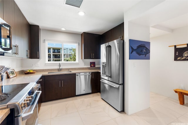 437 Kailua Rd Unit 6107, Kailua, HI 96734 - kitchen with appliances with stainless steel finishes, light marble finish floors, dark brown cabinetry, light countertops, and recessed lighting