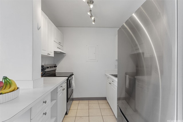 775 Kinalau Pl Unit 1806, Honolulu, HI 96813 - kitchen with stainless steel appliances, electric panel, light countertops, white cabinetry, and light tile patterned flooring