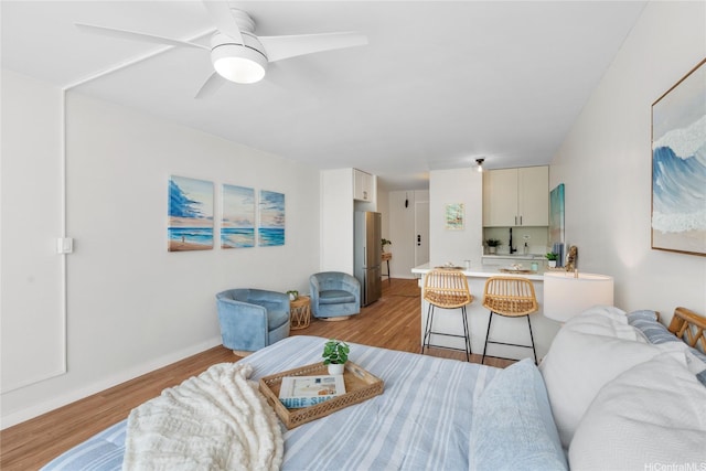53-549 Kamehameha Hwy Unit 313, Hauula, HI 96717 - living area featuring light wood-type flooring and a ceiling fan