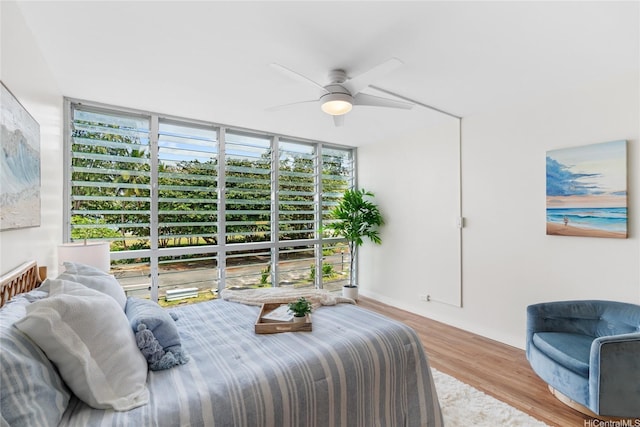 53-549 Kamehameha Hwy Unit 313, Hauula, HI 96717 - bedroom featuring expansive windows, wood finished floors, and ceiling fan