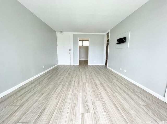 1556 Piikoi St Unit 506, Honolulu, HI 96822 - empty room with light wood-style floors and baseboards