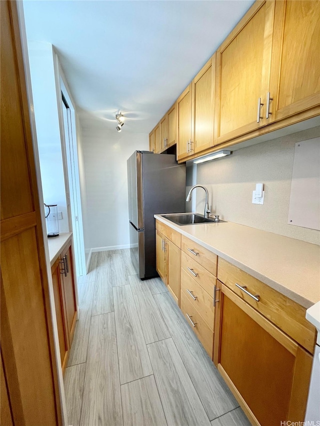 1556 Piikoi St Unit 506, Honolulu, HI 96822 - kitchen featuring light wood-style floors, light countertops, light brown cabinetry, and freestanding refrigerator