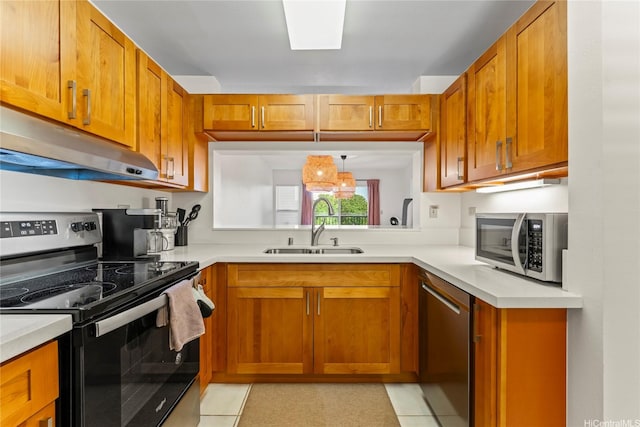 3075 Ala Poha Pl Unit 206, Honolulu, HI 96818 - kitchen with appliances with stainless steel finishes, under cabinet range hood, and brown cabinetry