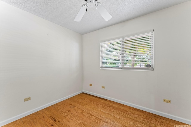 3075 Ala Poha Pl Unit 206, Honolulu, HI 96818 - unfurnished room featuring a ceiling fan, a textured ceiling, and light wood-type flooring