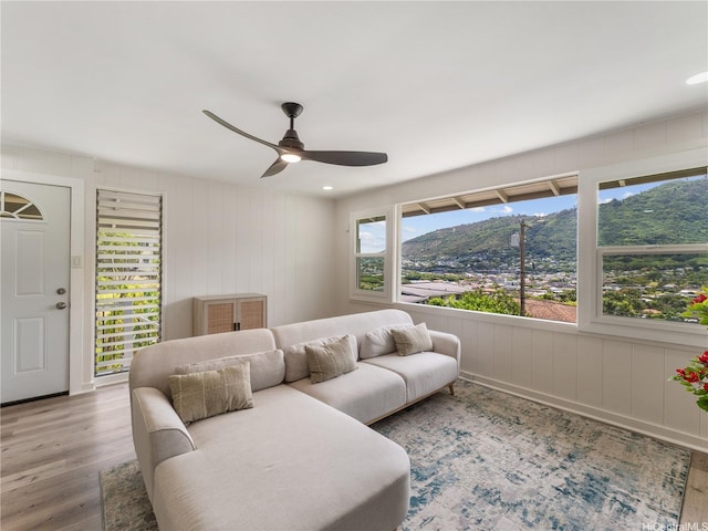 3063 Woolsey Pl, Honolulu, HI 96822 - living room featuring wood finished floors, ceiling fan, and a decorative wall