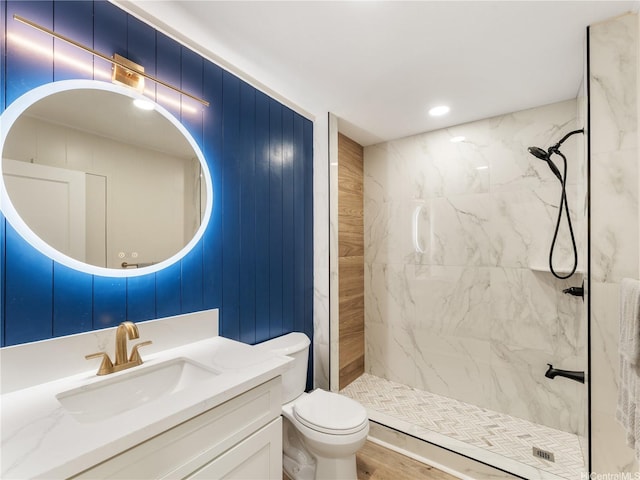 3063 Woolsey Pl, Honolulu, HI 96822 - full bathroom featuring vanity, a marble finish shower, and wood finished floors