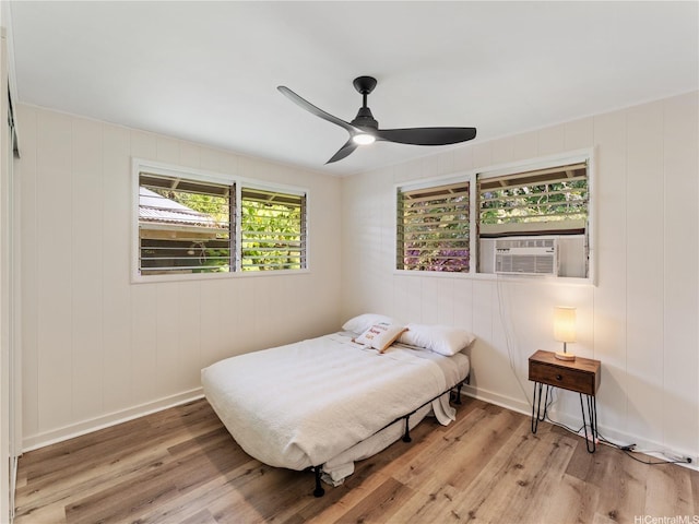3063 Woolsey Pl, Honolulu, HI 96822 - bedroom featuring light wood-type flooring, cooling unit, and ceiling fan