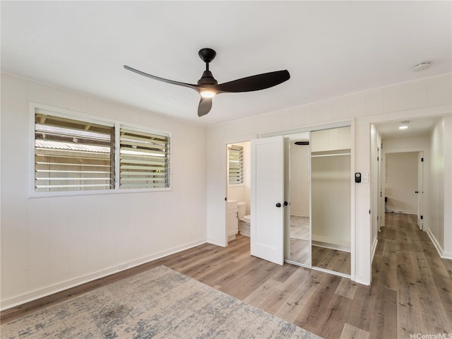 3063 Woolsey Pl, Honolulu, HI 96822 - unfurnished bedroom with light wood finished floors, a closet, and ceiling fan