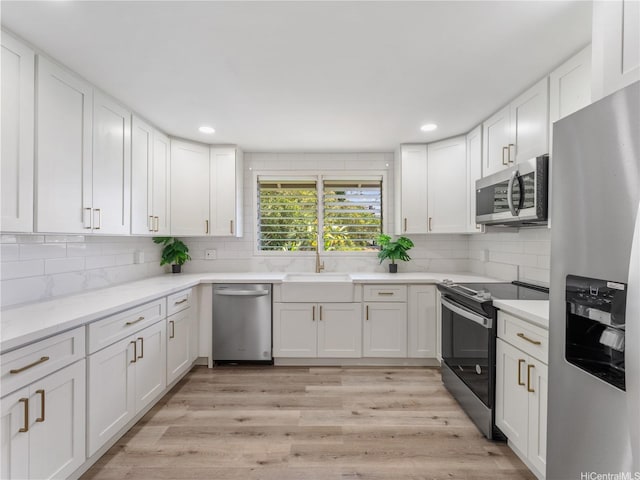 3063 Woolsey Pl, Honolulu, HI 96822 - kitchen with stainless steel appliances, tasteful backsplash, white cabinets, and recessed lighting