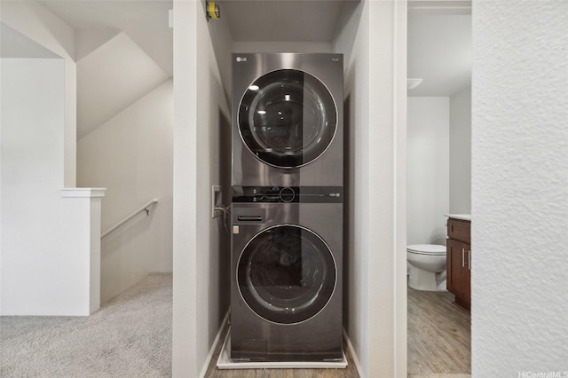642 Kakala St Unit 1311, Kapolei, HI 96707 - laundry area featuring stacked washer / drying machine and wood finished floors