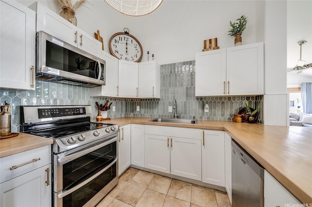 91-1516 Keonekapu St, Ewa Beach, HI 96706 - kitchen with stainless steel appliances, light countertops, backsplash, and white cabinets