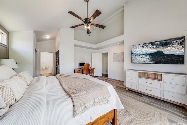 91-1516 Keonekapu St, Ewa Beach, HI 96706 - bedroom featuring light wood-type flooring, a desk, a high ceiling, ensuite bathroom, and ceiling fan
