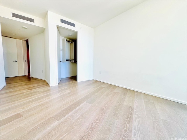 1000 Auahi St Unit 1600, Honolulu, HI 96814 - empty room with light wood-type flooring and baseboards