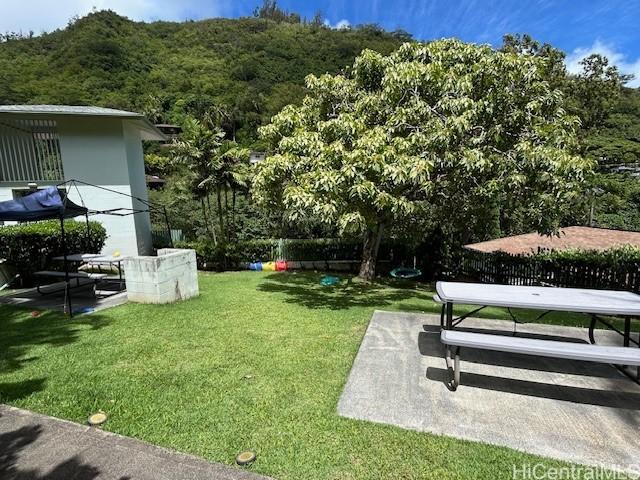 2556 Palolo Pl Unit 4B, Honolulu, HI 96816 - view of yard featuring a patio and a view of trees