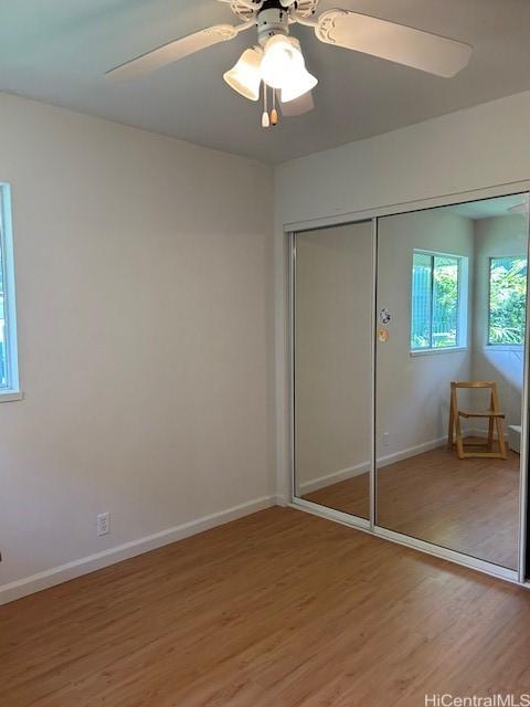 2556 Palolo Pl Unit 4B, Honolulu, HI 96816 - unfurnished bedroom featuring light wood finished floors, a closet, and ceiling fan