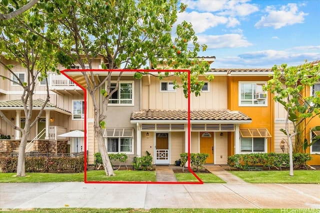 1180 Kakala St Unit 608, Kapolei, HI 96707 - townhome / multi-family property featuring a tiled roof and a front lawn