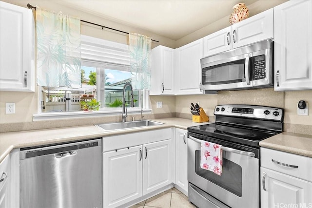 1180 Kakala St Unit 608, Kapolei, HI 96707 - kitchen featuring stainless steel appliances, white cabinets, light countertops, and light tile patterned flooring