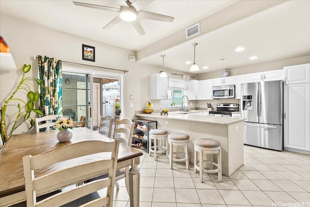 1180 Kakala St Unit 608, Kapolei, HI 96707 - kitchen featuring appliances with stainless steel finishes, recessed lighting, a peninsula, ceiling fan, and white cabinets