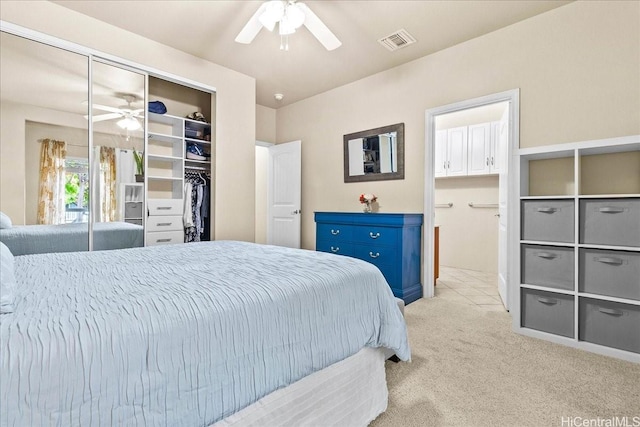 1180 Kakala St Unit 608, Kapolei, HI 96707 - bedroom featuring a closet, light carpet, connected bathroom, and a ceiling fan