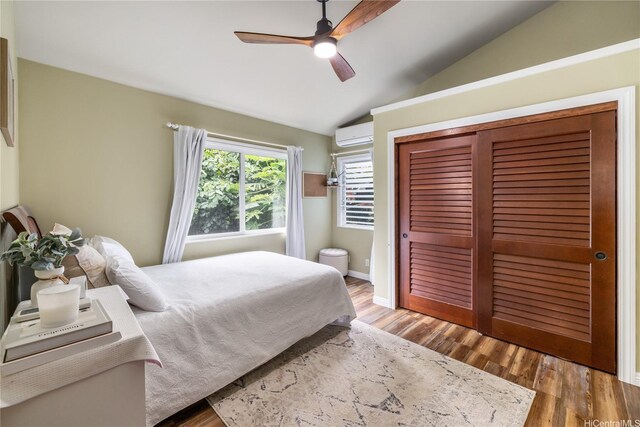 68-17 Laau Paina Pl, Waialua, HI 96791 - bedroom with vaulted ceiling, a closet, wood finished floors, ceiling fan, and an AC wall unit