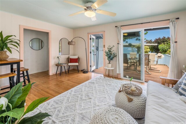 68-17 Laau Paina Pl, Waialua, HI 96791 - living area with wood finished floors, plenty of natural light, and a ceiling fan