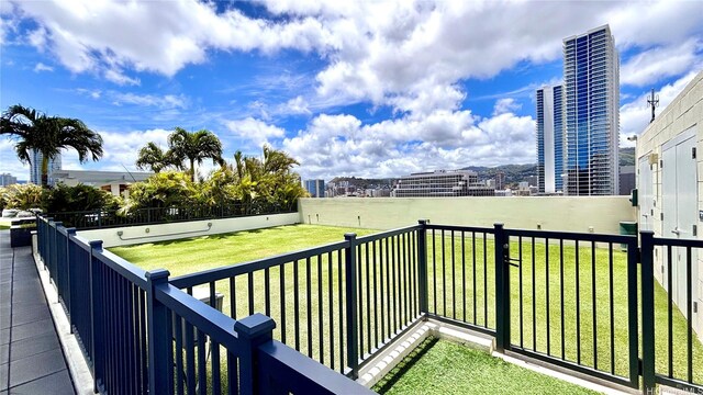 629 Keeaumoku St Unit 2310, Honolulu, HI 96814 - wooden deck featuring a yard
