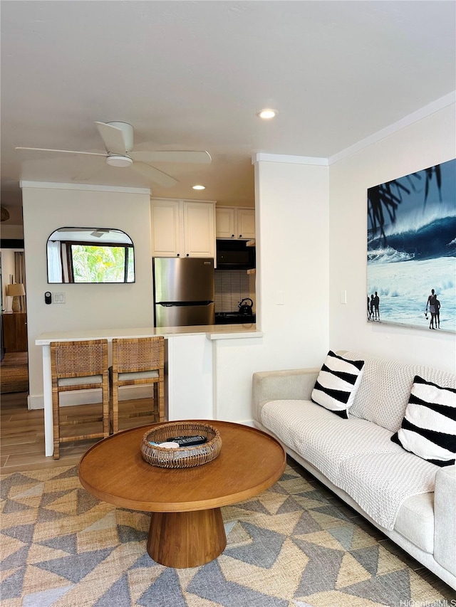 57-68 Eleku Kuilima Pl Unit 657, Kahuku, HI 96731 - living room with crown molding, recessed lighting, a ceiling fan, and wood finished floors